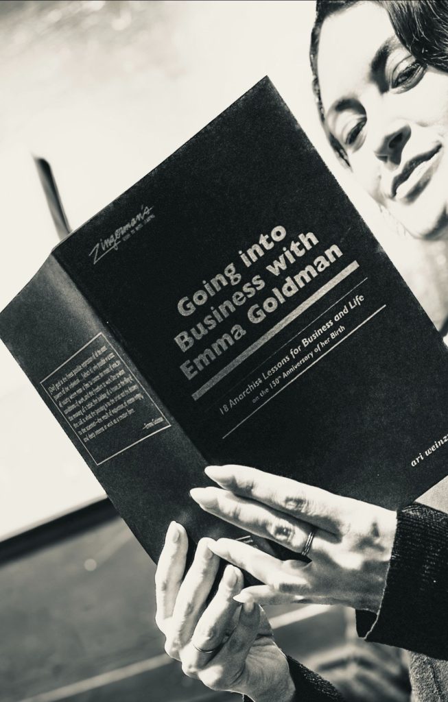 woman Holding Going into to Business with Emma Goldman Pamphlet